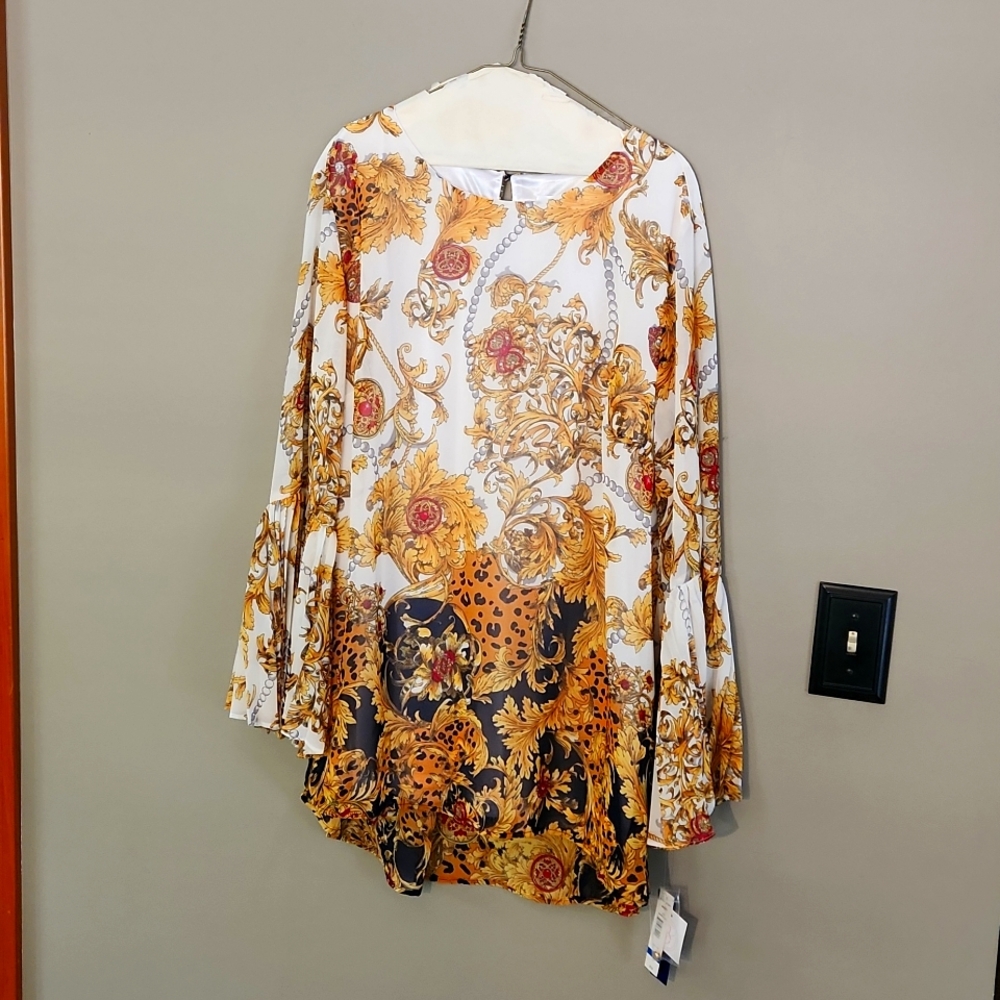 Dressy blouse. Also could be worn as a dress Size XL Colors of gold,cream, black